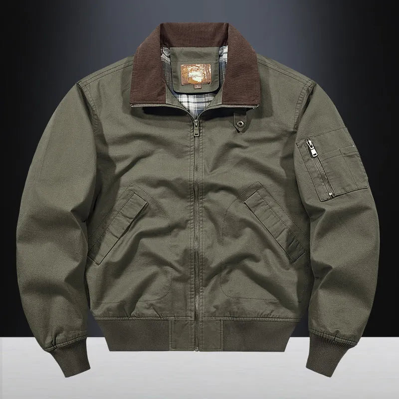 Men's washed cotton baseball flight jacket in beige, shown on a hanger.
