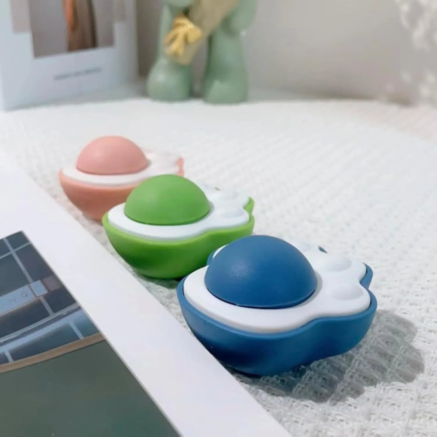 Four colourful catnip balls with textured surfaces for dental cleaning and interactive play