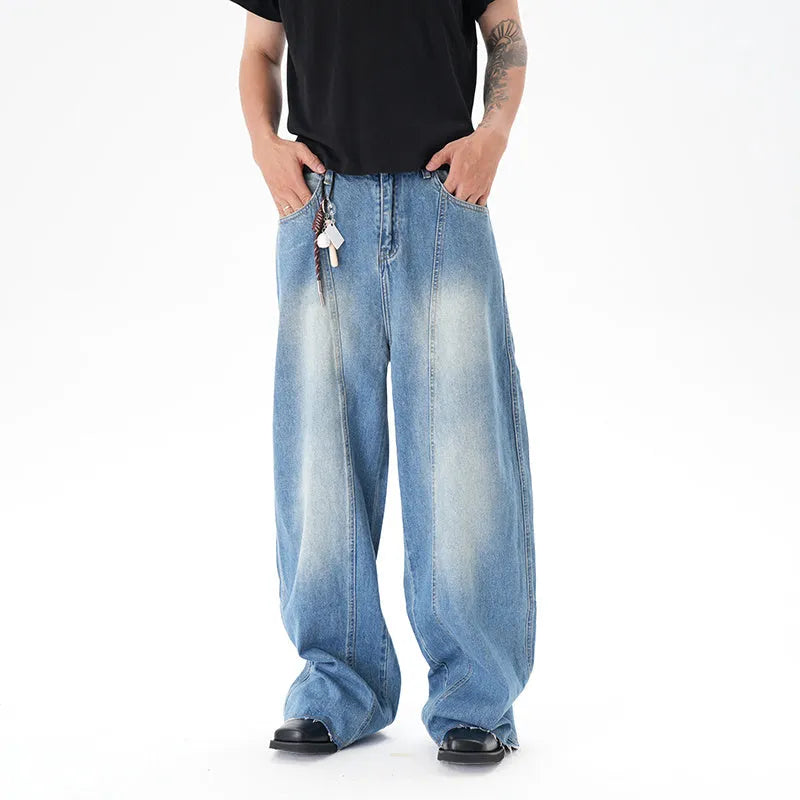Light blue vintage washed wide leg machete jeans with a straight fit and zipper fly on a model.