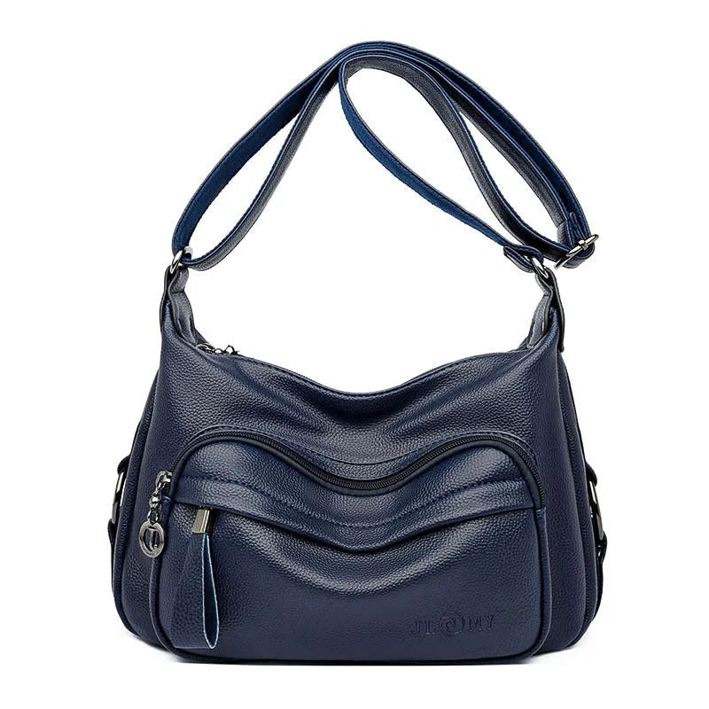 Blue horizontal square women's shoulder bag with soft PU construction and visible sewing thread detailing