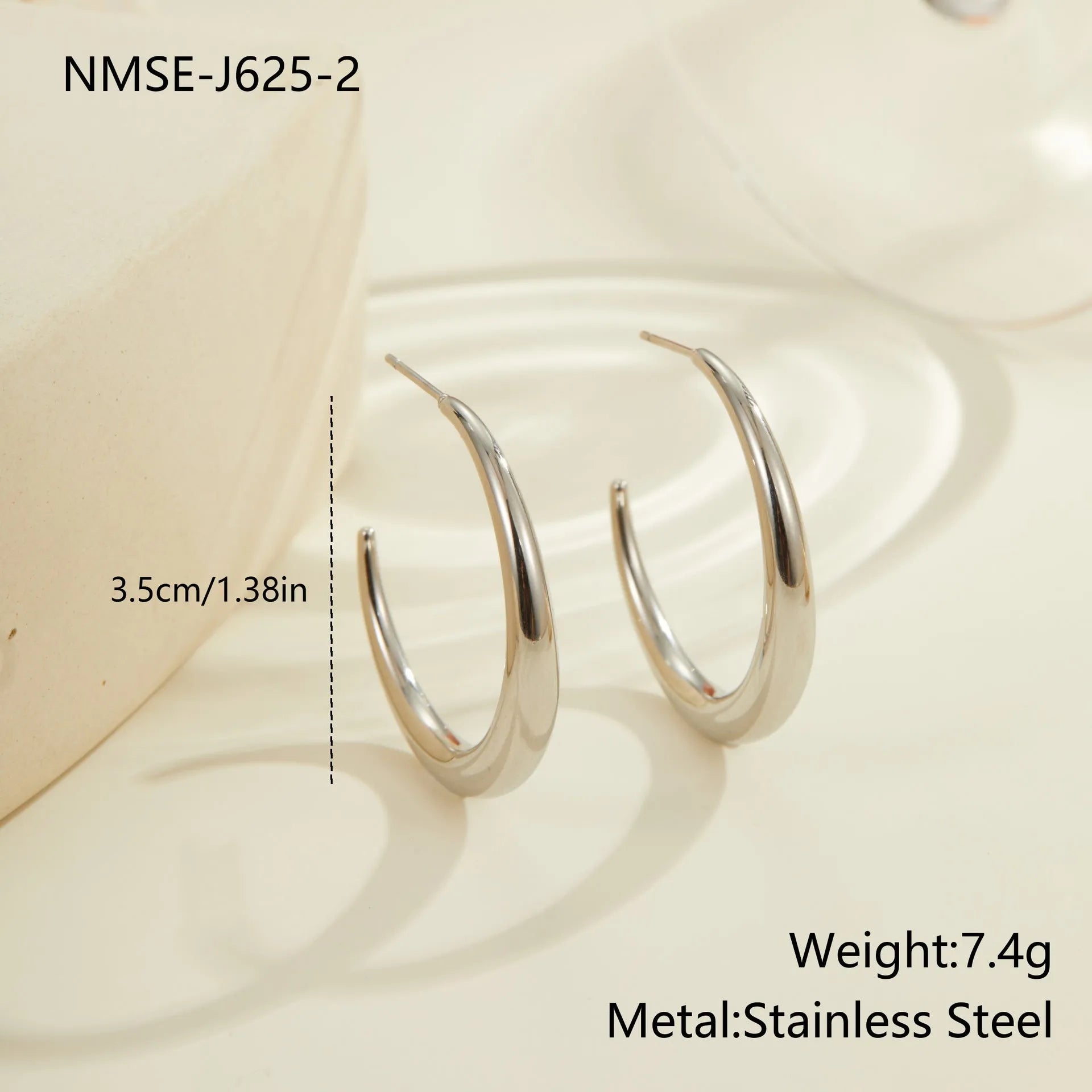 Titanium steel geometric hoop earrings with circular design and gold or steel finishes