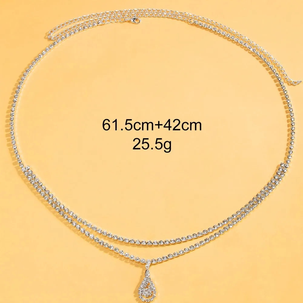 Gold rhinestone waist chain with tassel drop pendant and lobster clasp closure