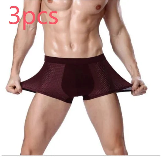 Men's solid colour ice silk modal boxer briefs with a U convex design on a mid waist.