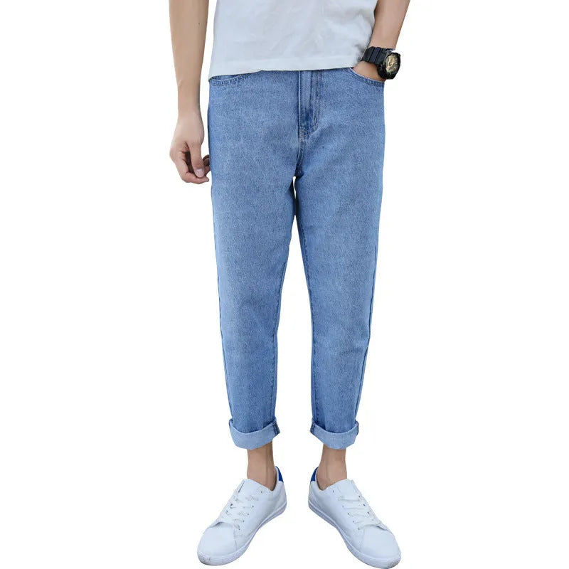 Men's black loose straight-leg jeans with small harem opening on hanger