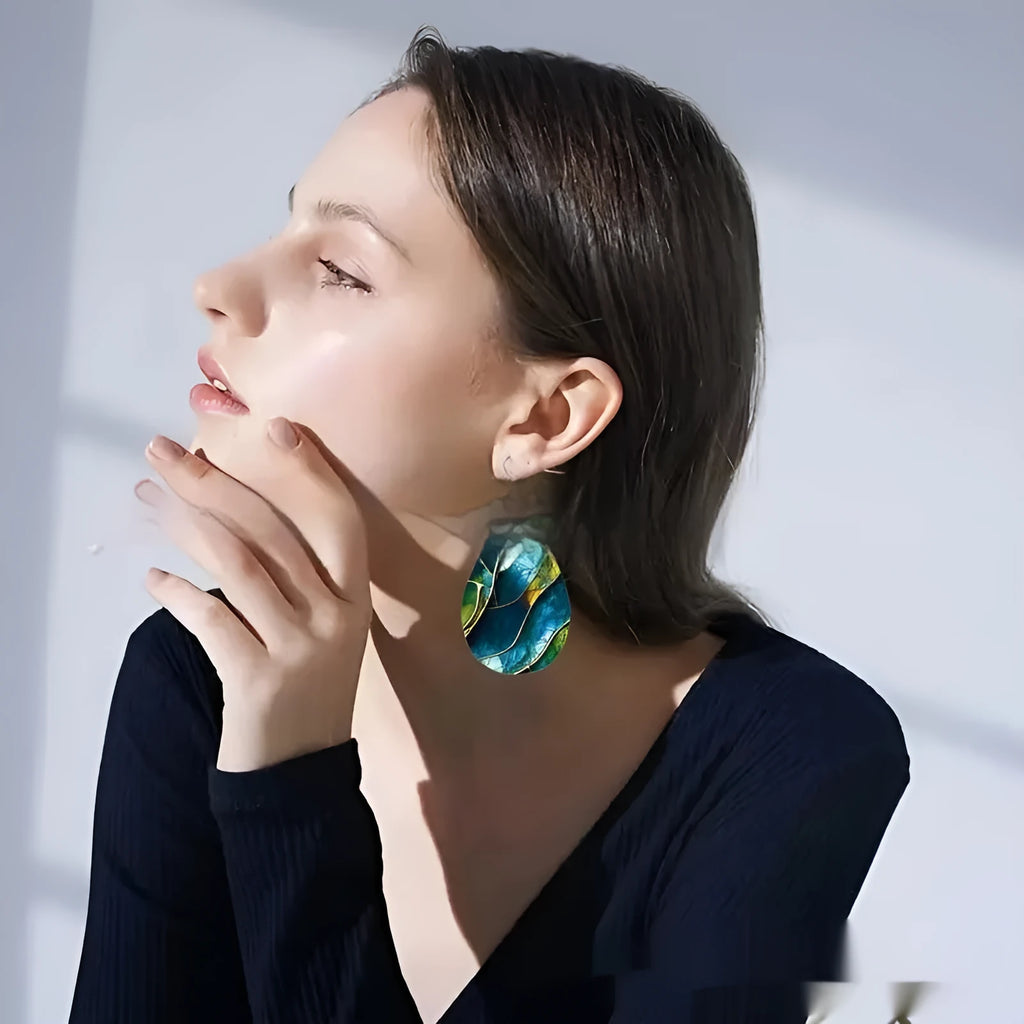 Pair of flat acrylic drop earrings with printed branch knot design in unisex style