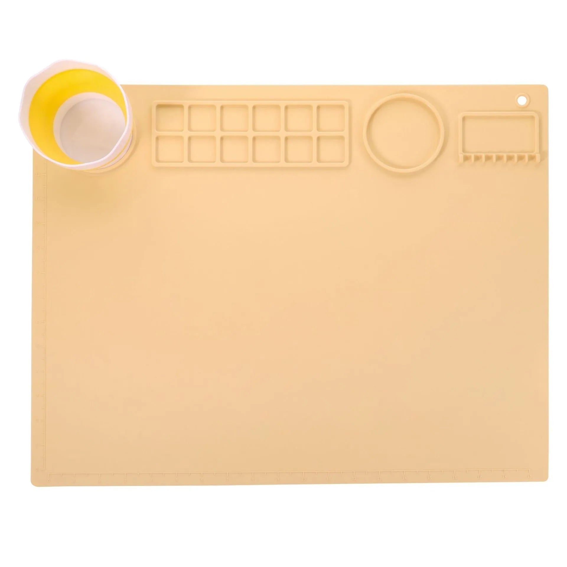 Light blue silicone painting mat with two round bowls on a 50cm by 40cm rectangular surface.