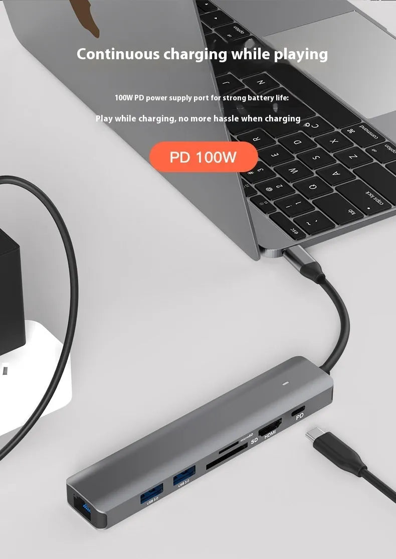 Black USB-C 7-in-1 computer hub with HDMI, USB ports and memory card slots