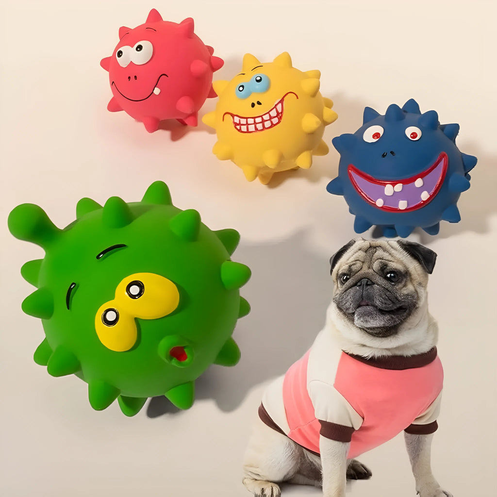 Four colourful squeaky dog balls with cute faces made from natural latex rubber with textured surfaces