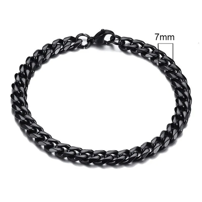 Six-sided geometric link metal bracelet in gold colour on a wrist.