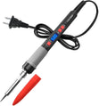 Grey 90W electric soldering iron kit with ceramic heating core, five tips, sponge, and tin wire on a workbench.