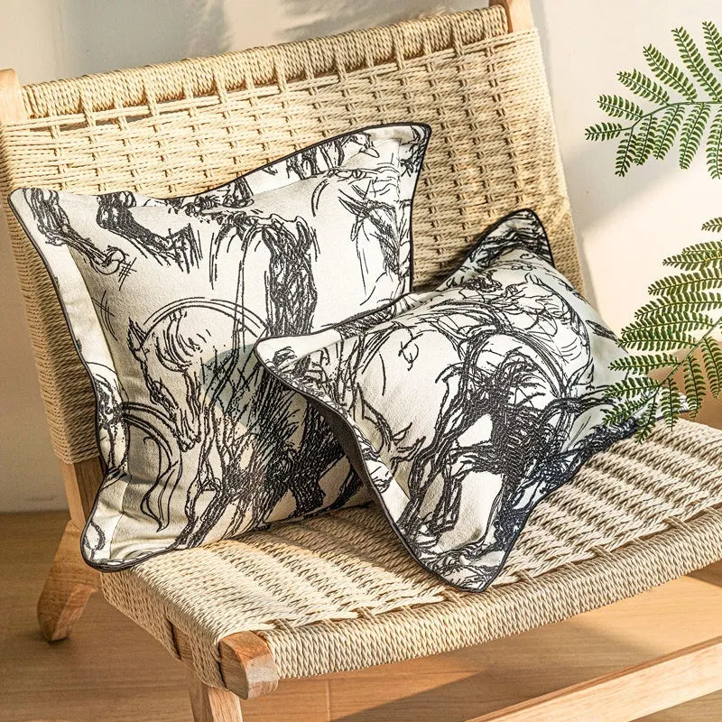 Close-up of a modern abstract golden horse design on a textured jacquard cushion in golden yellow.