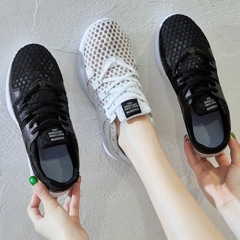Low-top casual sneaker with a white mesh upper featuring a hollow breathable design and a flat EVA sole.
