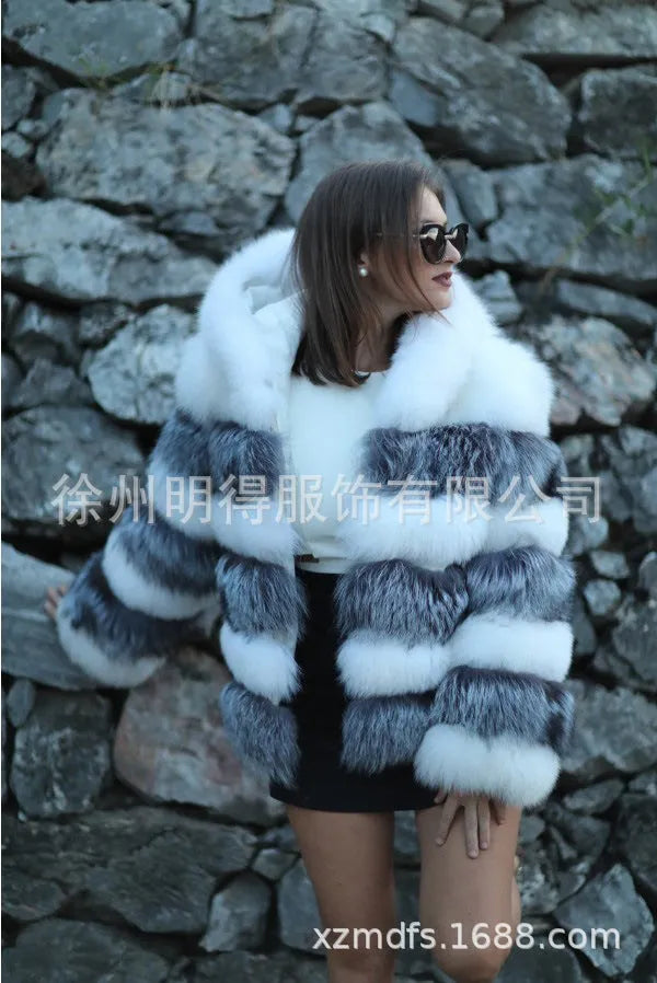 A woman's loose-fitting artificial fur hooded coat in street fashion style.