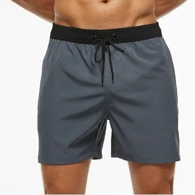 Men's blue training shorts with stitching waist detail and headband pocket for running and fitness