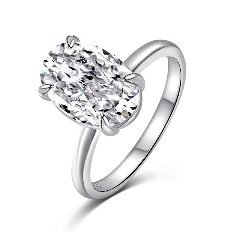 Oval women's ring with four-prong claw setting in gold or silver finish on a 9 silver band.