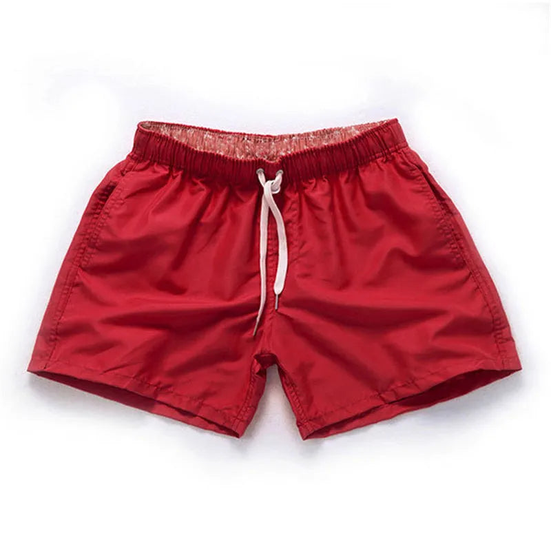 Men's straight leg beach shorts in multiple colours, made from polyester fabric, shown on size chart from S to 4XL.