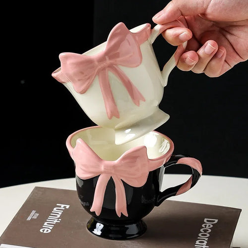Ceramic mug with heart bow design in Black Pink colour, 301-400ml capacity.