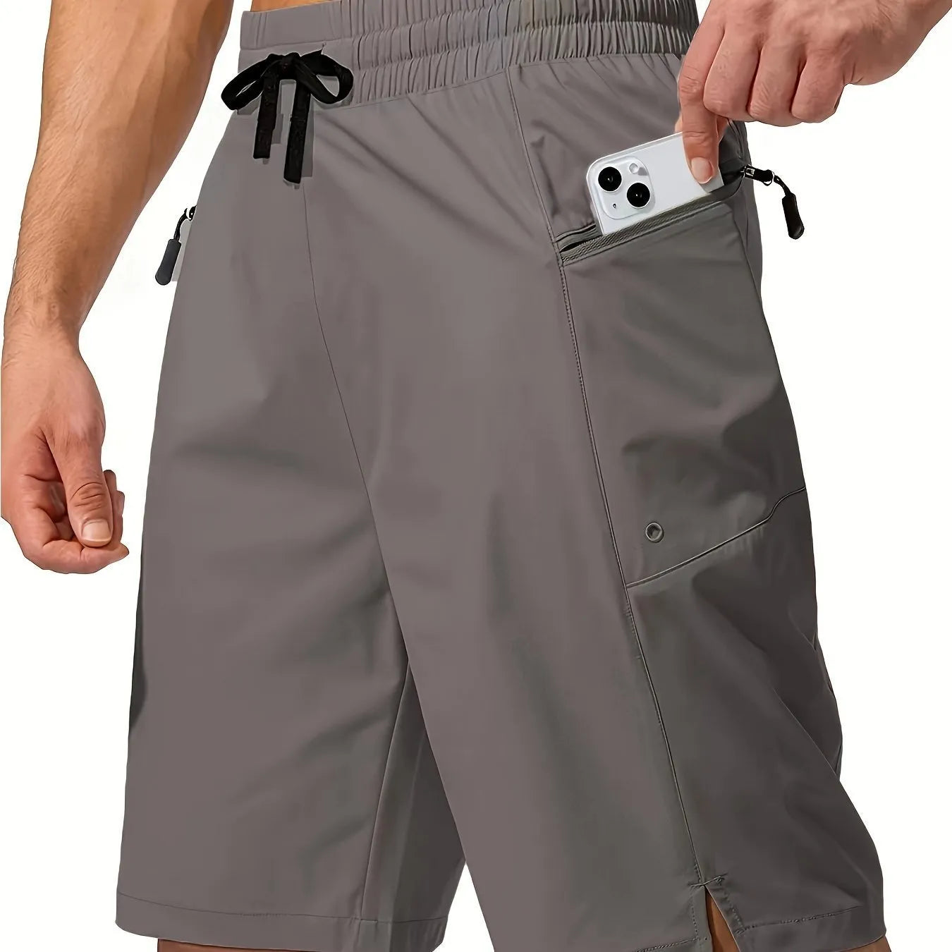 Man wearing solid grey quick-drying polyester beach shorts with a straight leg design.