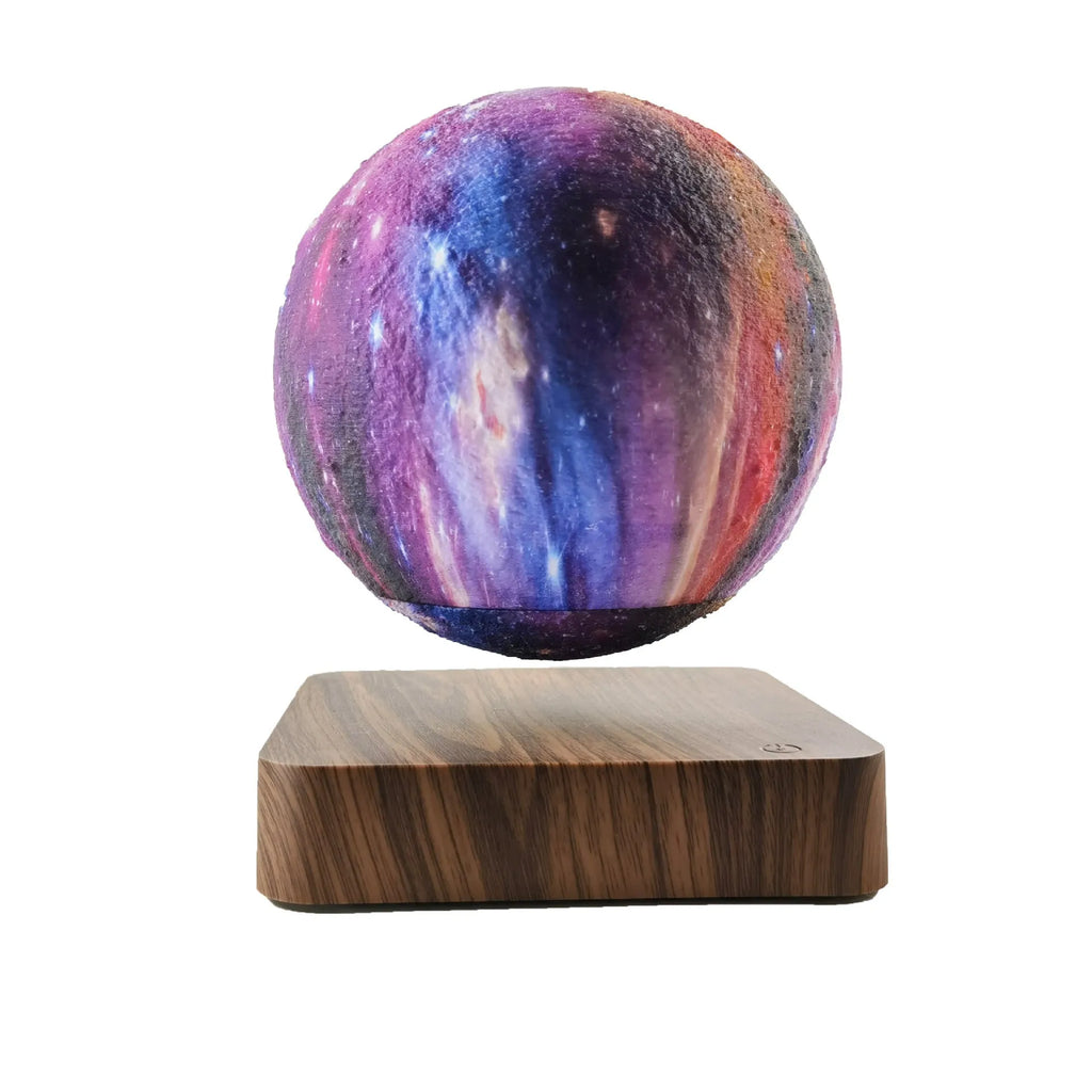 Magnetic levitation galaxy decorative light with floating moon lamp above walnut colour base