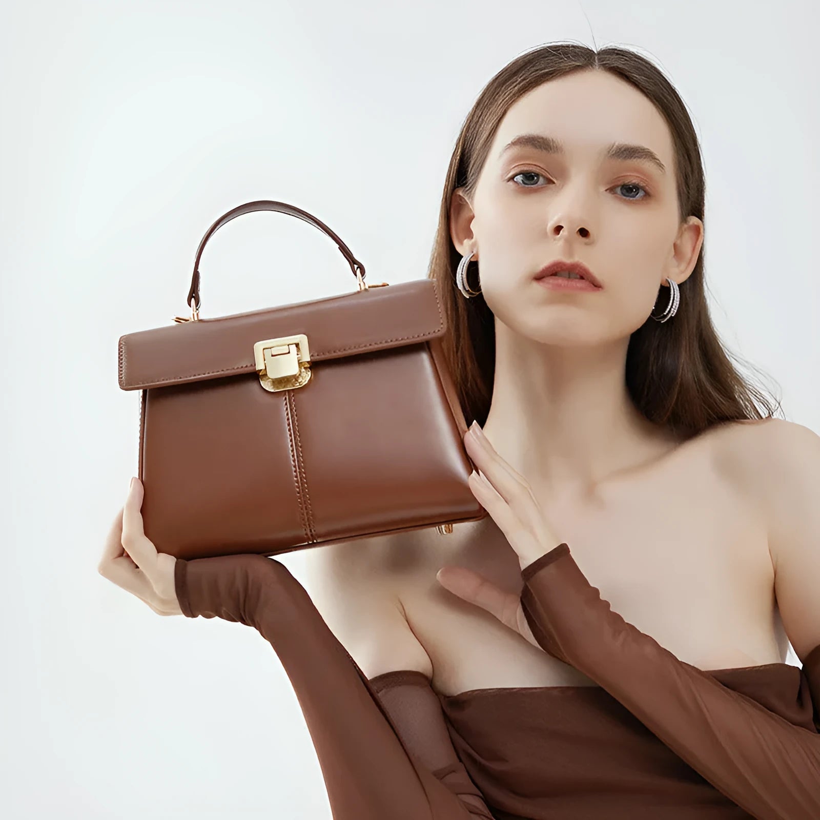 Women's black genuine leather shoulder handbag with vachette clasp in horizontal square shape