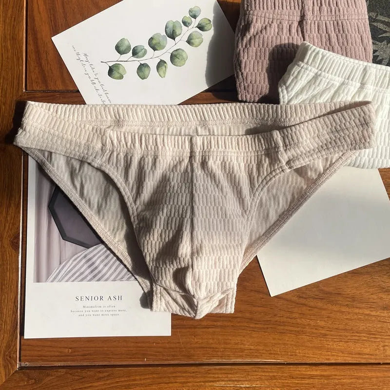 Men's solid colour cotton triangle underwear briefs with mid waistband, shown in apricot black colour.
