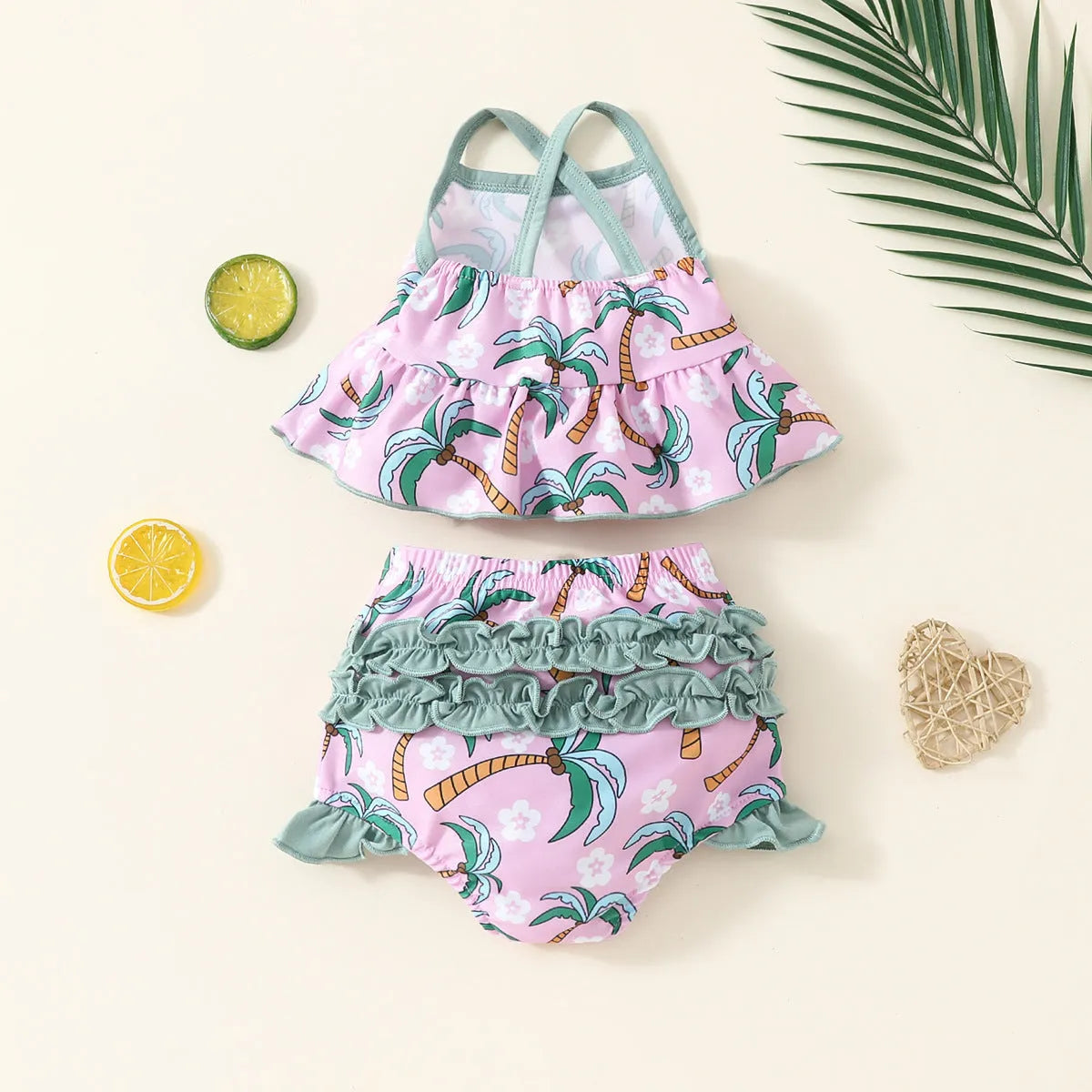 White children's two-piece swimsuit set with a top and matching shorts on a hanger.
