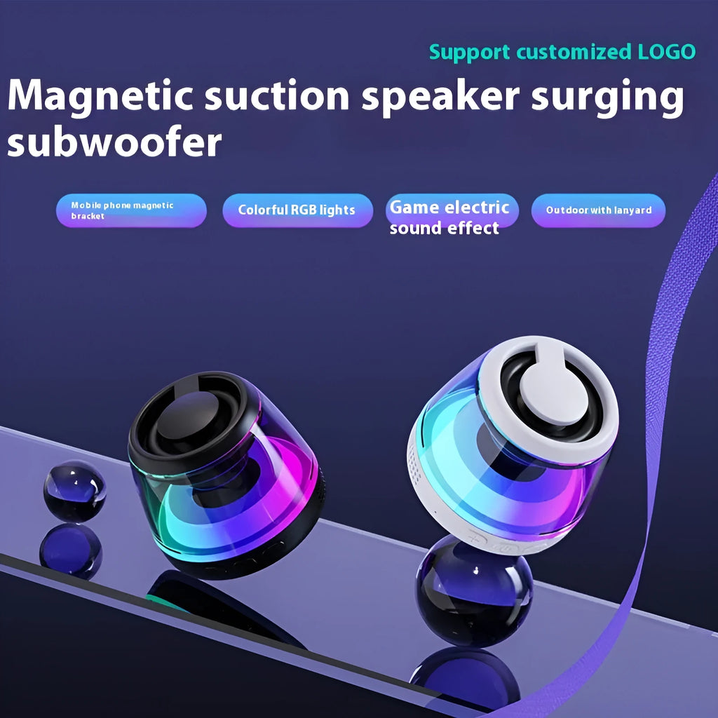 Black and white portable Bluetooth speaker with magnetic base and ambient lighting on desktop