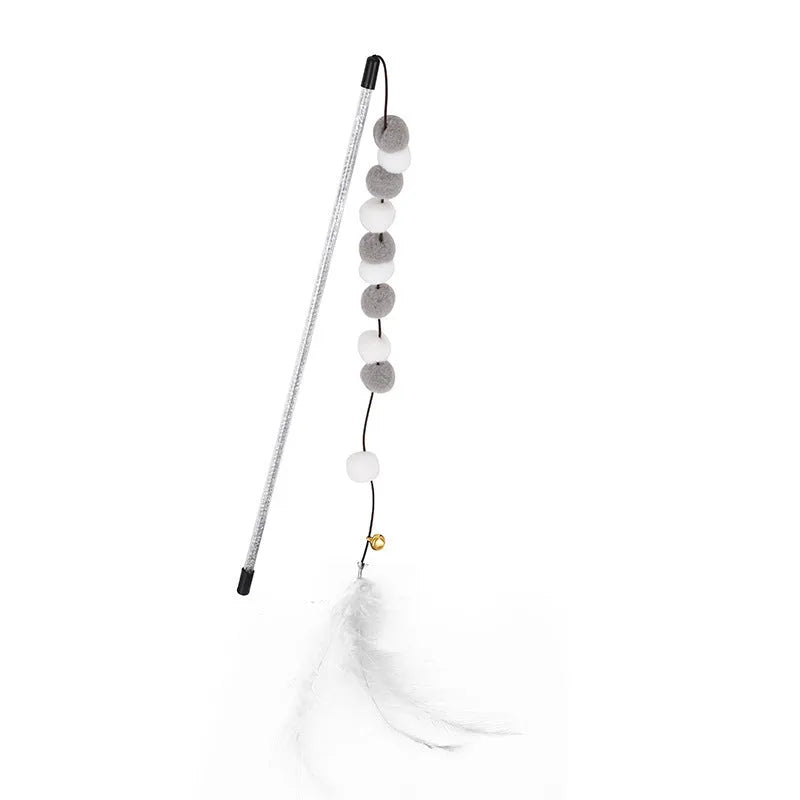 Grey and yellow cat teaser stick with a bell and a pompon feather, shown next to a blue and pink version.
