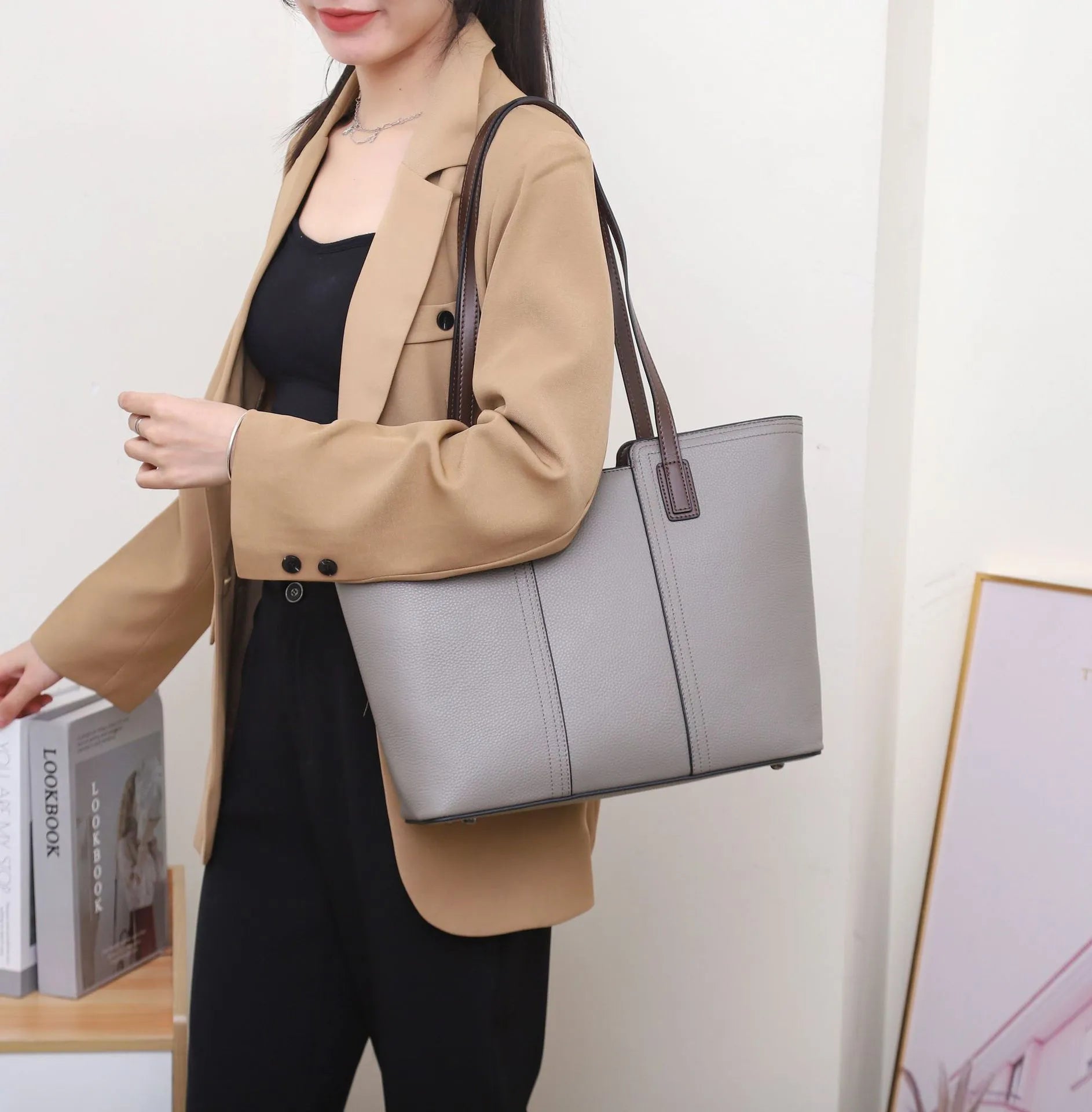 Genuine leather women's commuter shoulder bag in box-type shape with sewing line detailing and mobile phone compartment