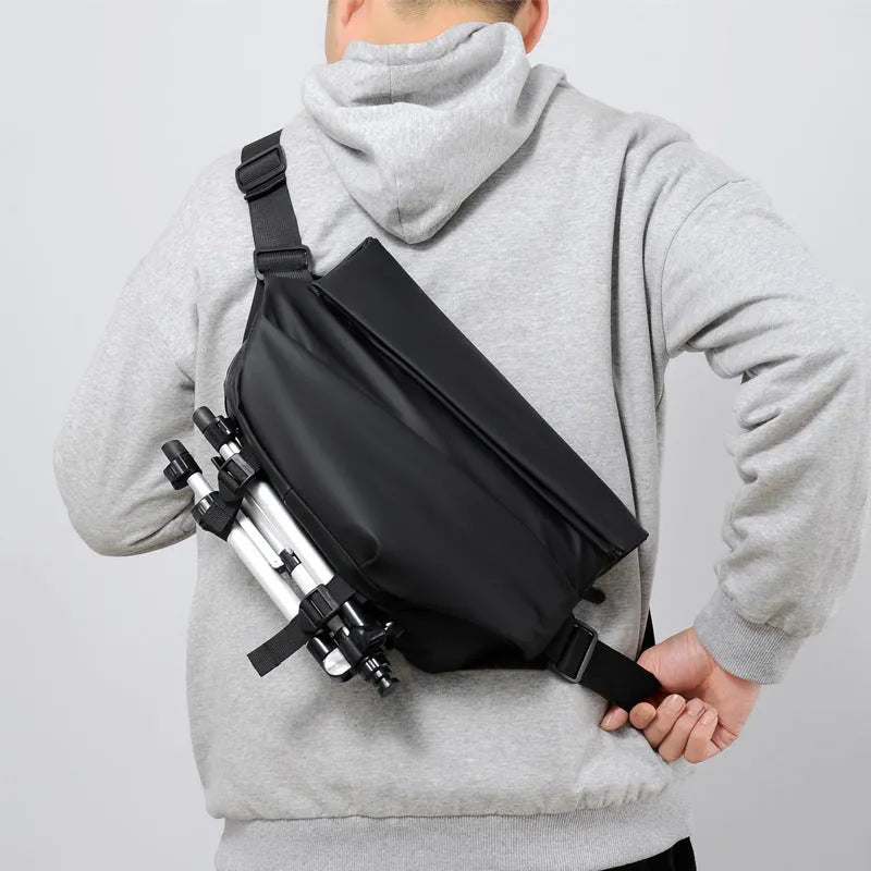 Grey medium square crossbody bag for men showing internal phone and document compartments
