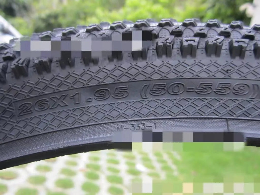 Ultralight puncture resistant mountain bike tyre shown in multiple sizes including 26, 27.5, and 29 inch diameters.