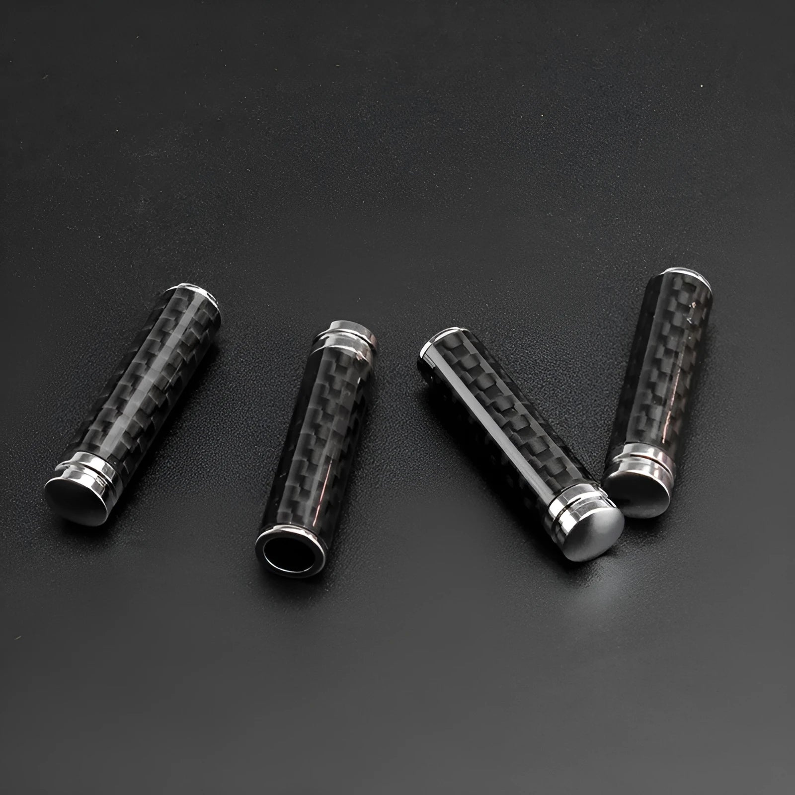 Carbon fibre door lift decorative cover set showing four units for vehicle installation