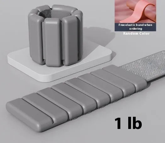 A black silicone weight-bearing bracelet with Velcro fastening, shown with 1lb and 2lb weight options.