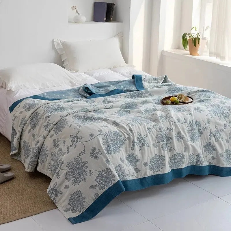 Thickened five-layer gauze pure cotton bed blanket in roulette wheel blue pattern.