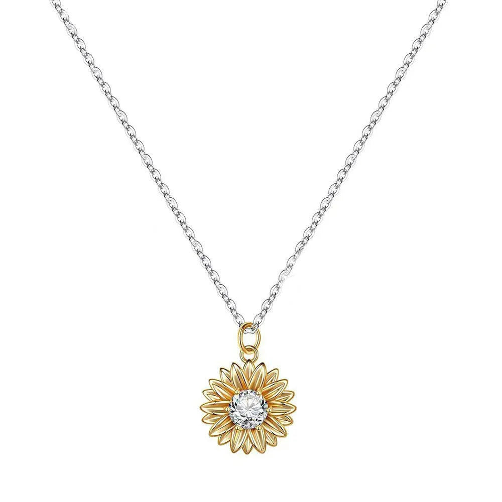 Sterling silver sunflower necklace with adjustable chain on white background