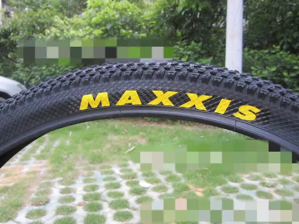 Ultralight puncture resistant mountain bike tyre shown in multiple sizes including 26, 27.5, and 29 inch diameters.