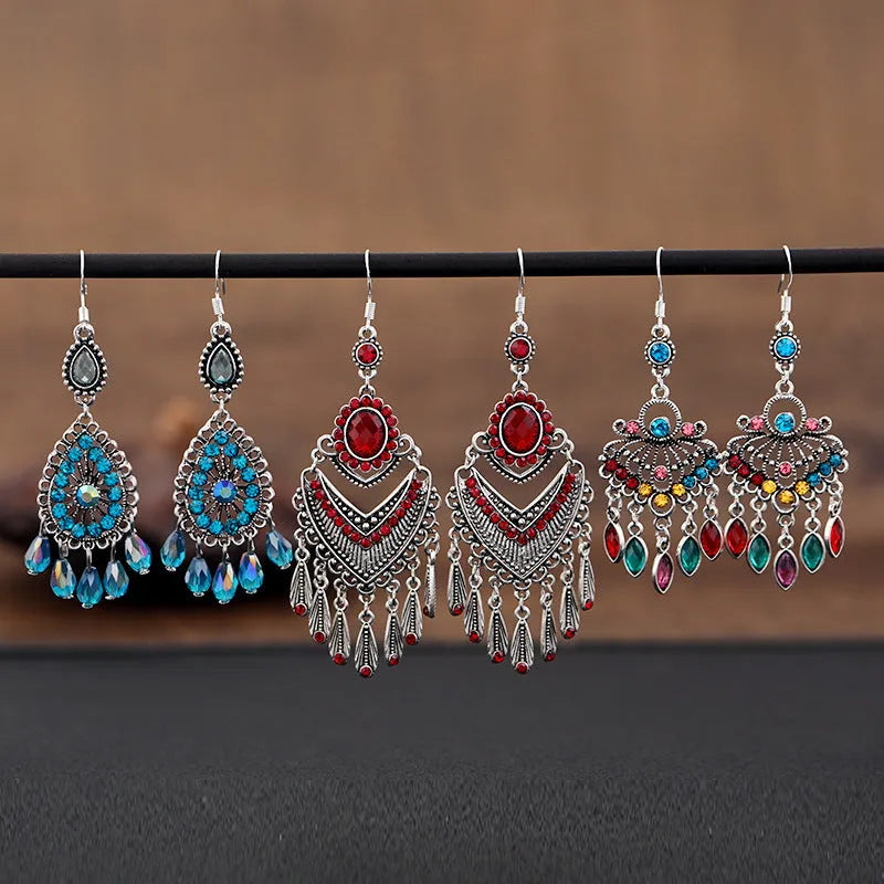 Purple retro drop earrings with dangling crystal fringe elements and ethnic style detailing