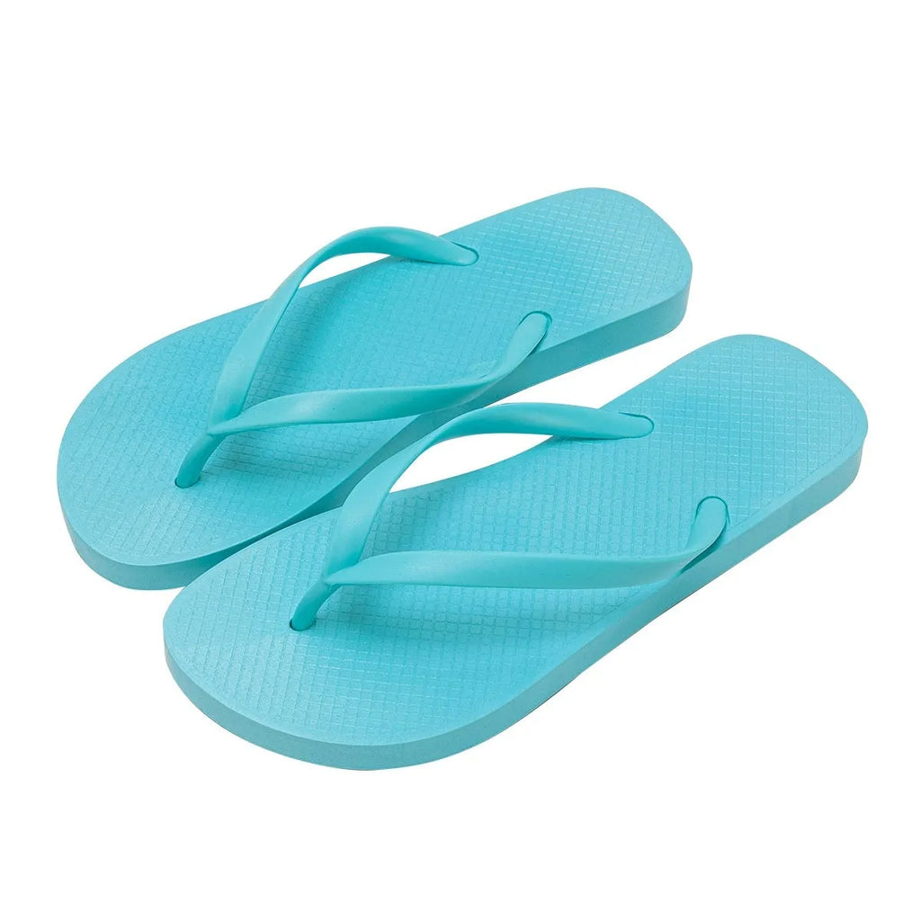 A pair of flat casual slippers with a hollow-out plastic upper and a textured non-slip PVC sole.