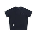 Loose grey waffle-textured t-shirt with embroidered retro lettering on the chest.
