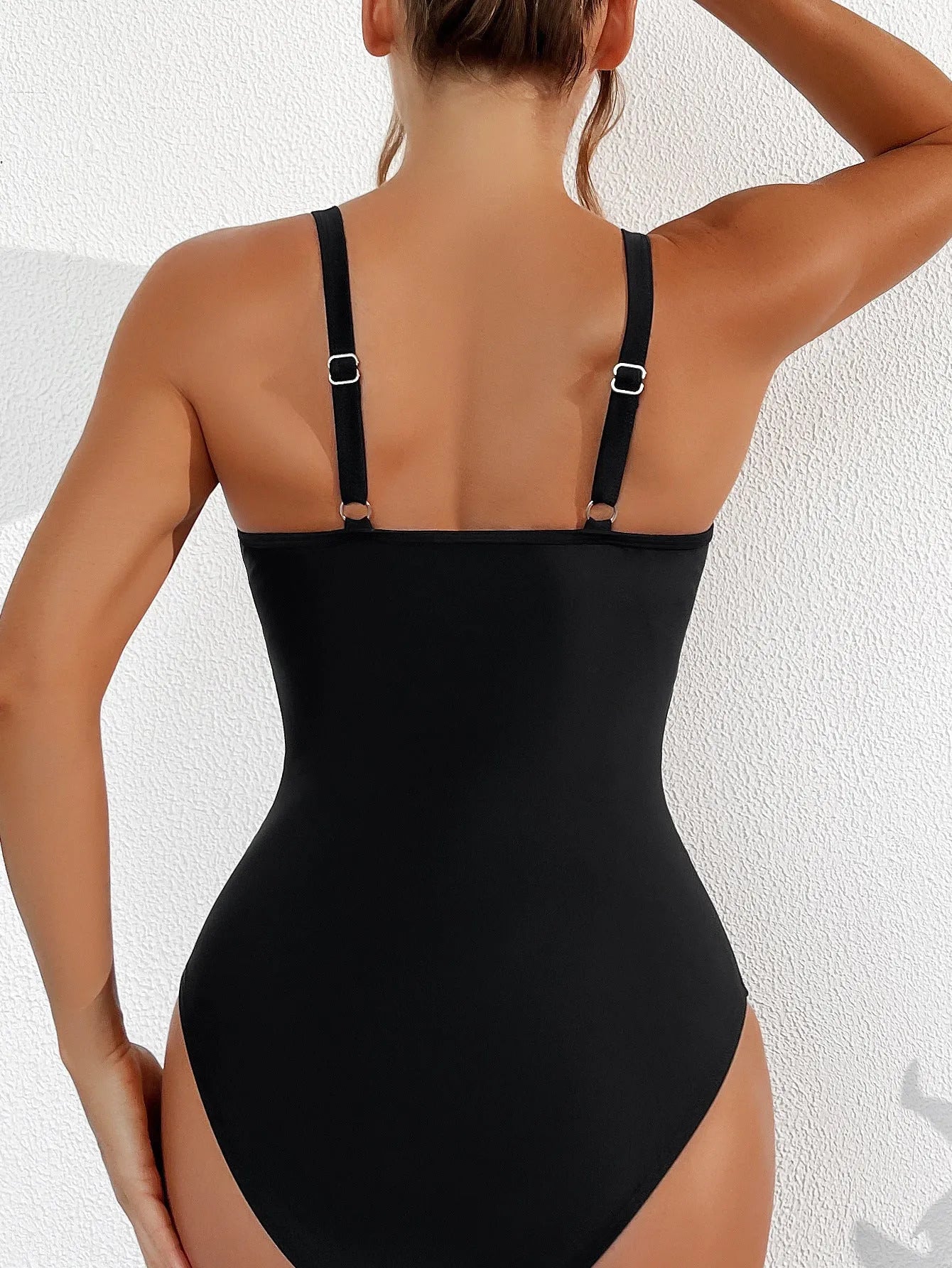 Black women's one-piece swimsuit with halter neck and mesh detail