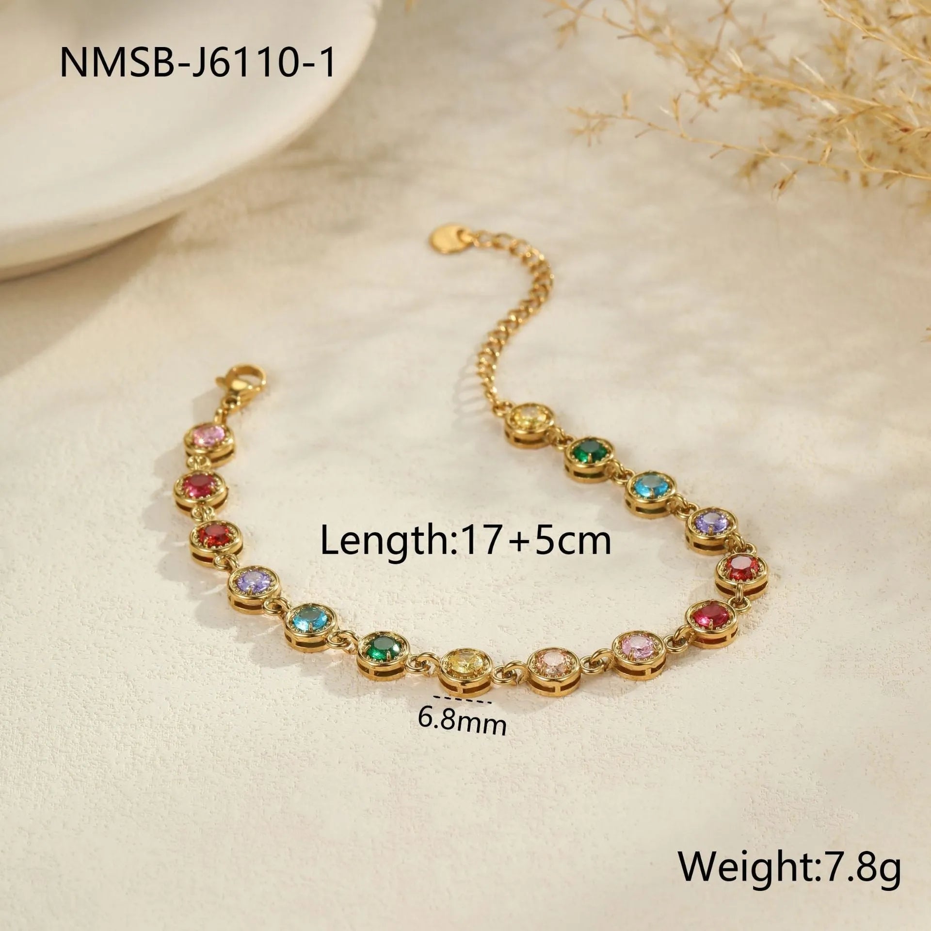 Gold and silver electroplated stainless steel bracelet with square, heart, and round geometric designs