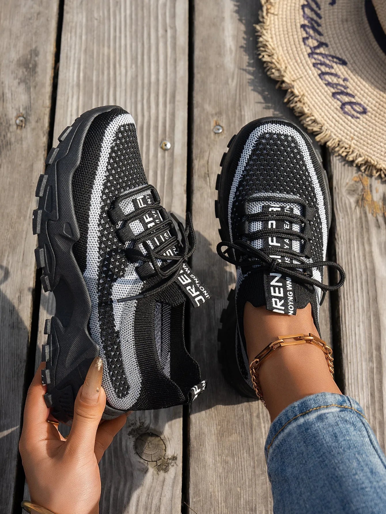 Women's Flyknit mesh lace-up sneakers in multiple colours on a rubber sole.