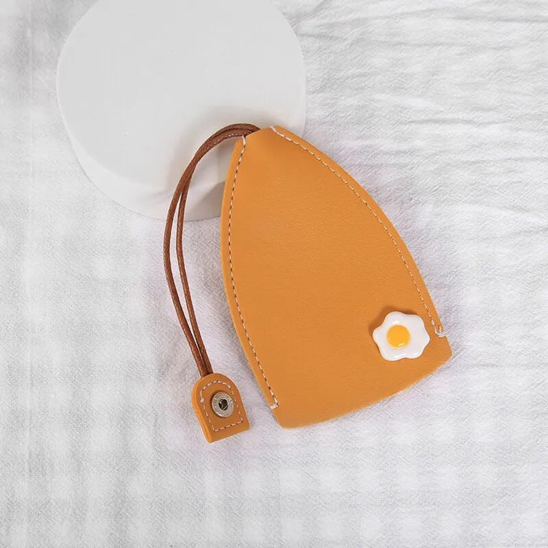 Cartoon pull-out car key case in PU leather with colourful designs measuring 14 x 7.5 cm