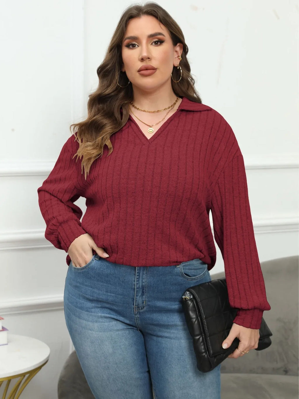 Women's plus size gray polo collar fleece shirt with lantern sleeves on a hanger