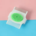 Small blue or green multifunctional dog grooming tool with hair removal and massage functions