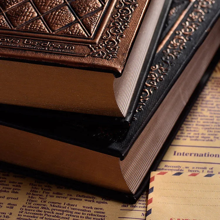Embossed faux leather notepad in bronze colour option showing its textured cover and thick profile.