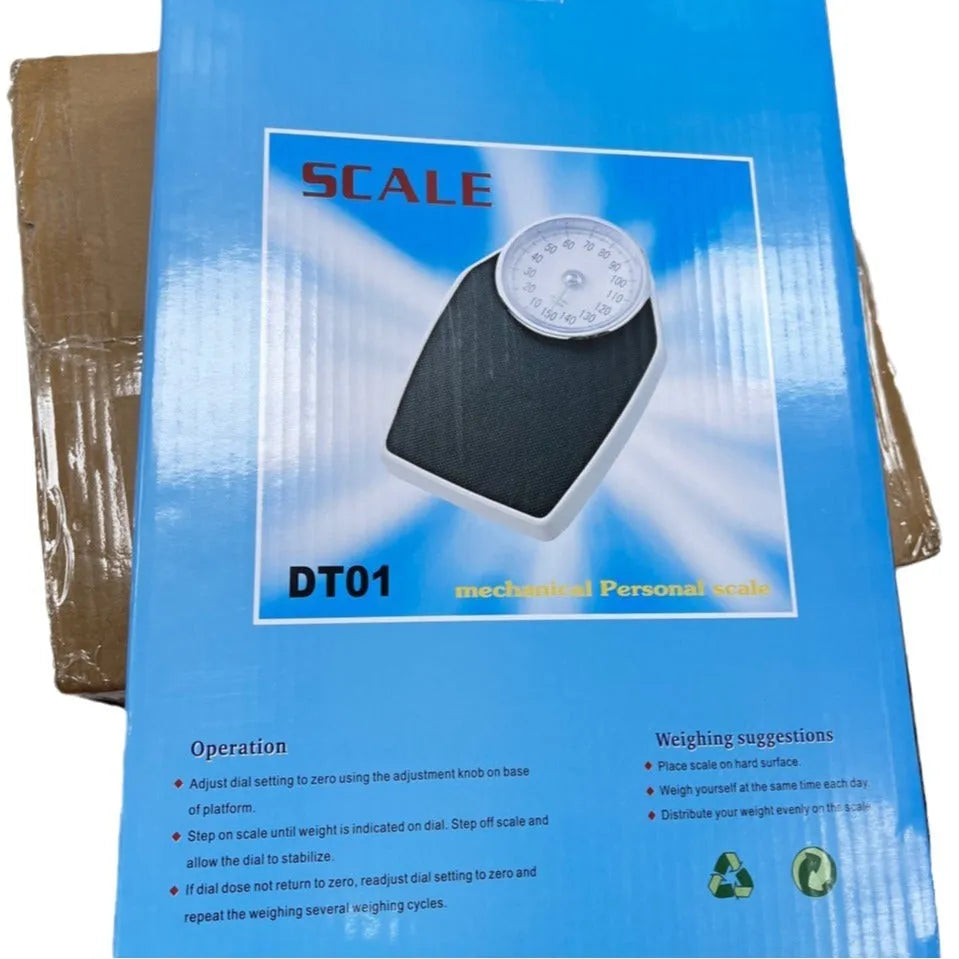 Black mechanical bathroom scales with large analogue dial showing weight measurements