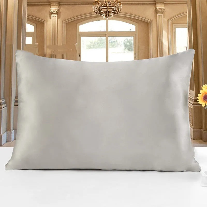19 M double-sided silk pillowcase in apricot colour showing smooth texture and hem detail.