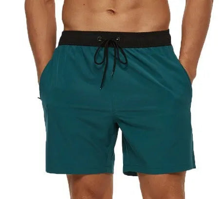 Men's blue training shorts with stitching waist detail and headband pocket for running and fitness