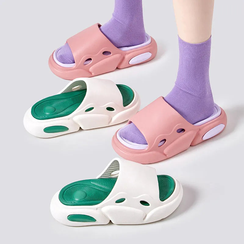 Women's and men's two-colour thick-soled EVA slippers with leather lining on a beach